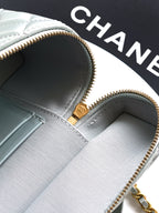 Light blue Chanel bag interior with gold zipper and logo pull tab