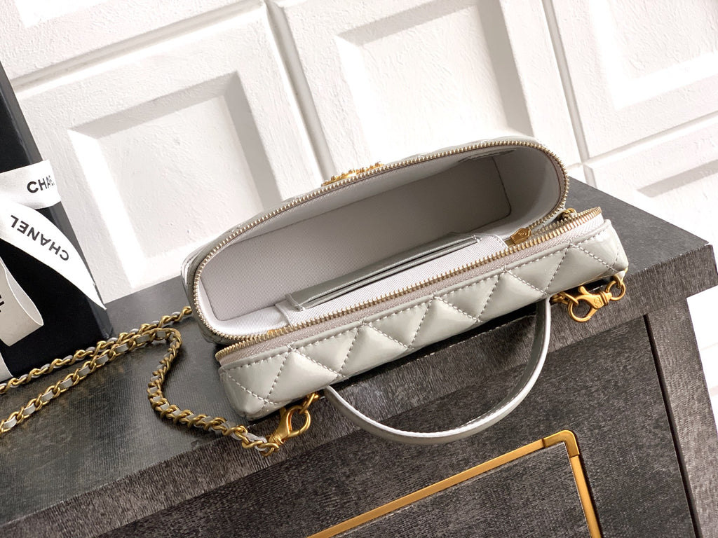 Chanel quilted bag with top zipper, light silver-gray, gold-tone chain shoulder strap