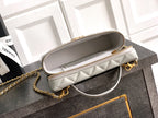 Chanel quilted bag with top zipper, light silver-gray, gold-tone chain shoulder strap