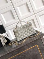 Chanel quilted mini top-handle bag, light silver-gray, gold-tone chain strap