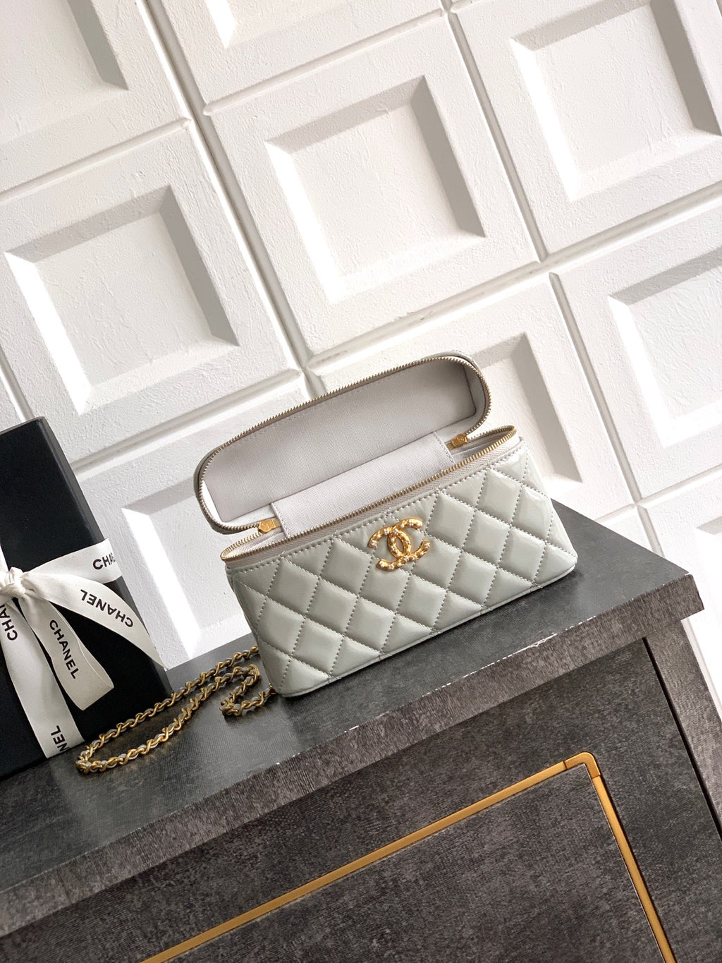 Chanel quilted mini bag with carry strap, light silver-gray, gold-tone hardware