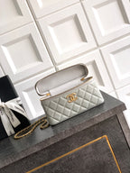 Chanel quilted mini bag with carry strap, light silver-gray, gold-tone hardware