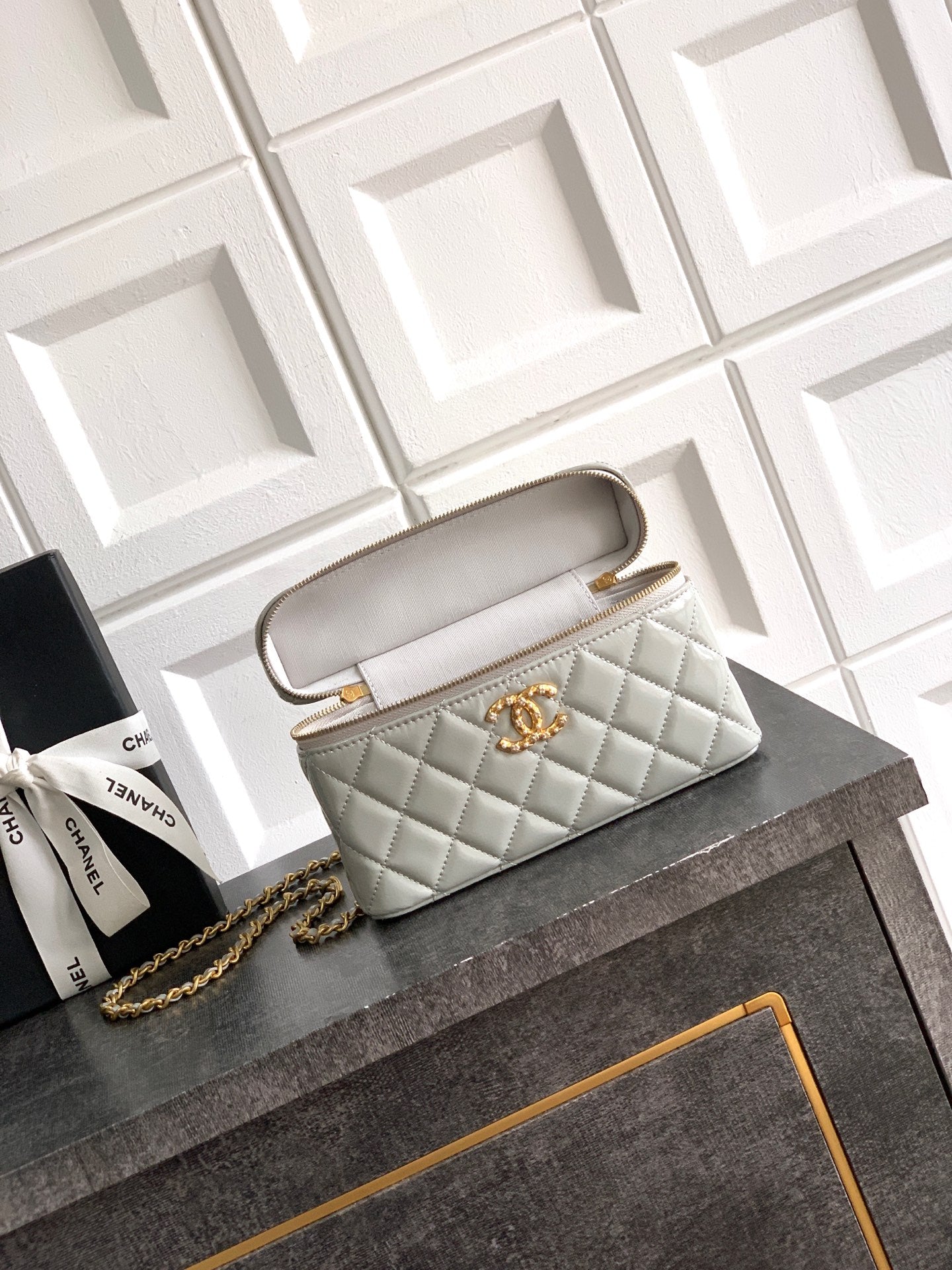 Chanel quilted mini bag with carry strap, light silver-gray, gold-tone hardware