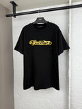 Louis Vuitton black short-sleeve T-shirt with gold embroidered “Quiltn”-style logo on chest