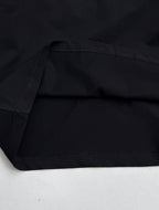 Louis Vuitton black T-shirt fabric with visible stitching at sleeve and body hem