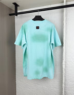 Louis Vuitton graphic T-shirt, light turquoise, back view with small logo patch.