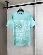 Louis Vuitton graphic T-shirt, light turquoise, large front lettering.