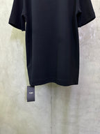 Dark navy T-shirt back with small FENDI tag hanging at the hem