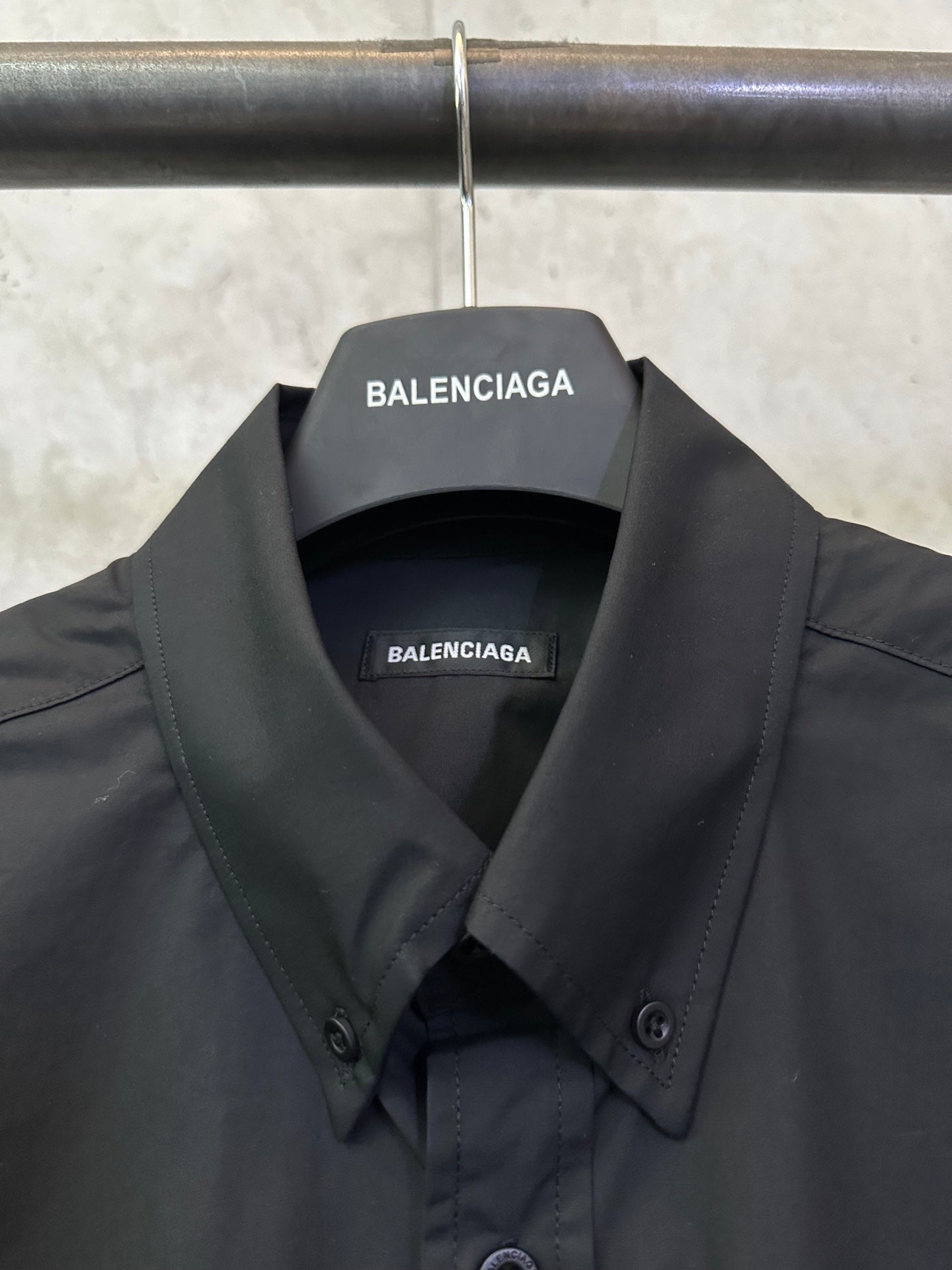 Balenciaga long-sleeve shirt collar, dark black with BALENCIAGA inner label.