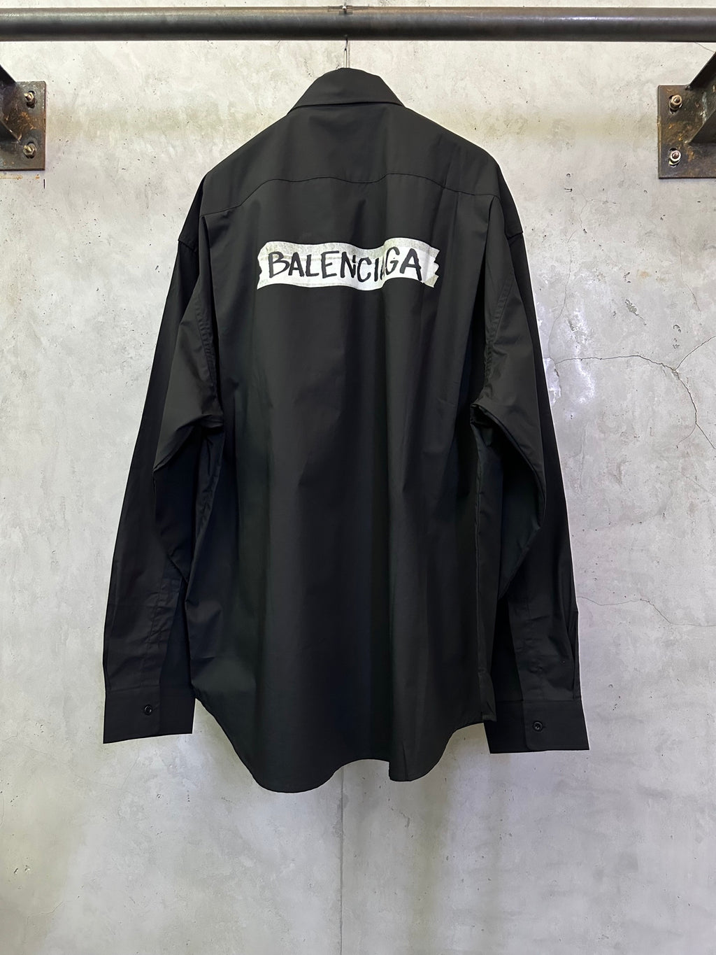 Balenciaga long-sleeve shirt, dark black, back graphic logo across shoulders.