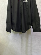 Balenciaga long-sleeve shirt, black, front lower section with visible pocket and buttons