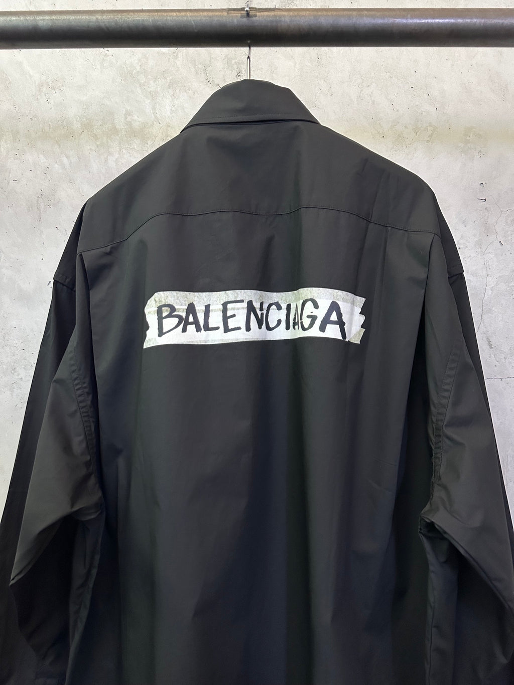 Balenciaga long-sleeve shirt, dark black, back with BALENCIAGA logo band.