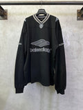 Black Balenciaga long-sleeve top with striped collar and large front logo print