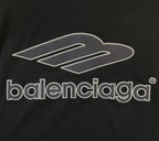 Balenciaga black short-sleeve jersey close-up of white 'balenciaga' logo print
