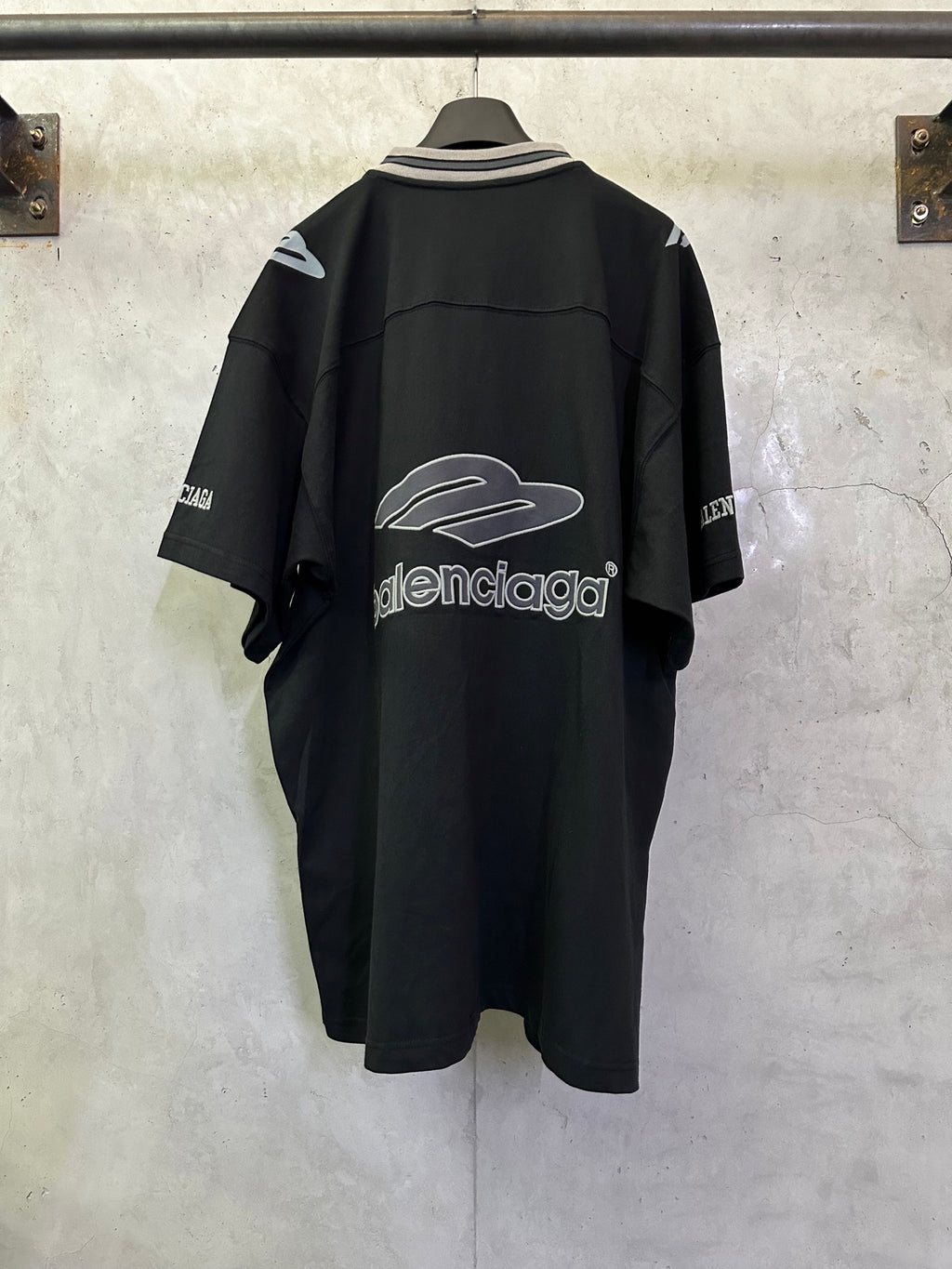 Balenciaga black short-sleeve jersey back with large white logo print and sleeve lettering