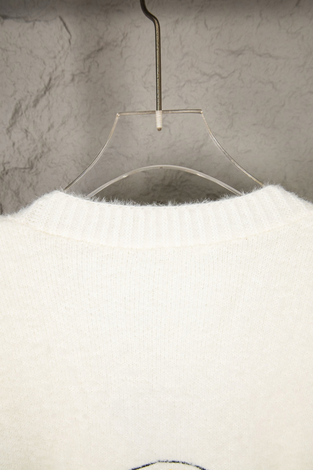 White knit long-sleeve sweater, ribbed collar detail