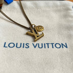 Gold-tone Louis Vuitton LV pendant necklace with star charm on chain