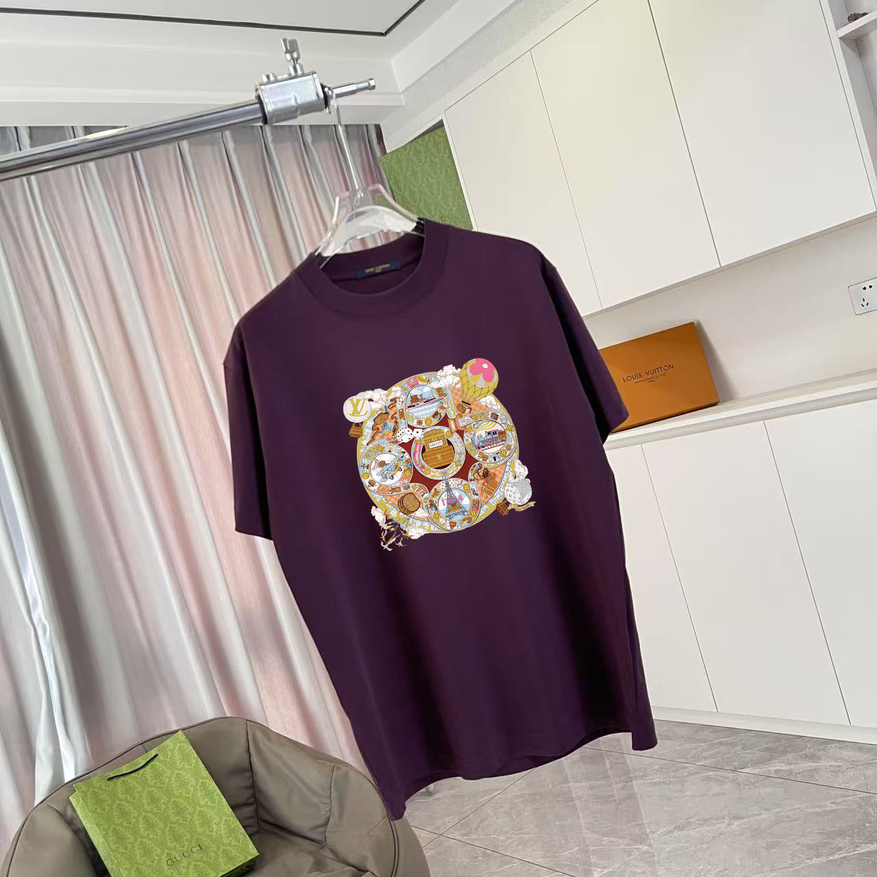 Louis Vuitton dark purple T-shirt with multicolor bear emblem graphic, short sleeves.