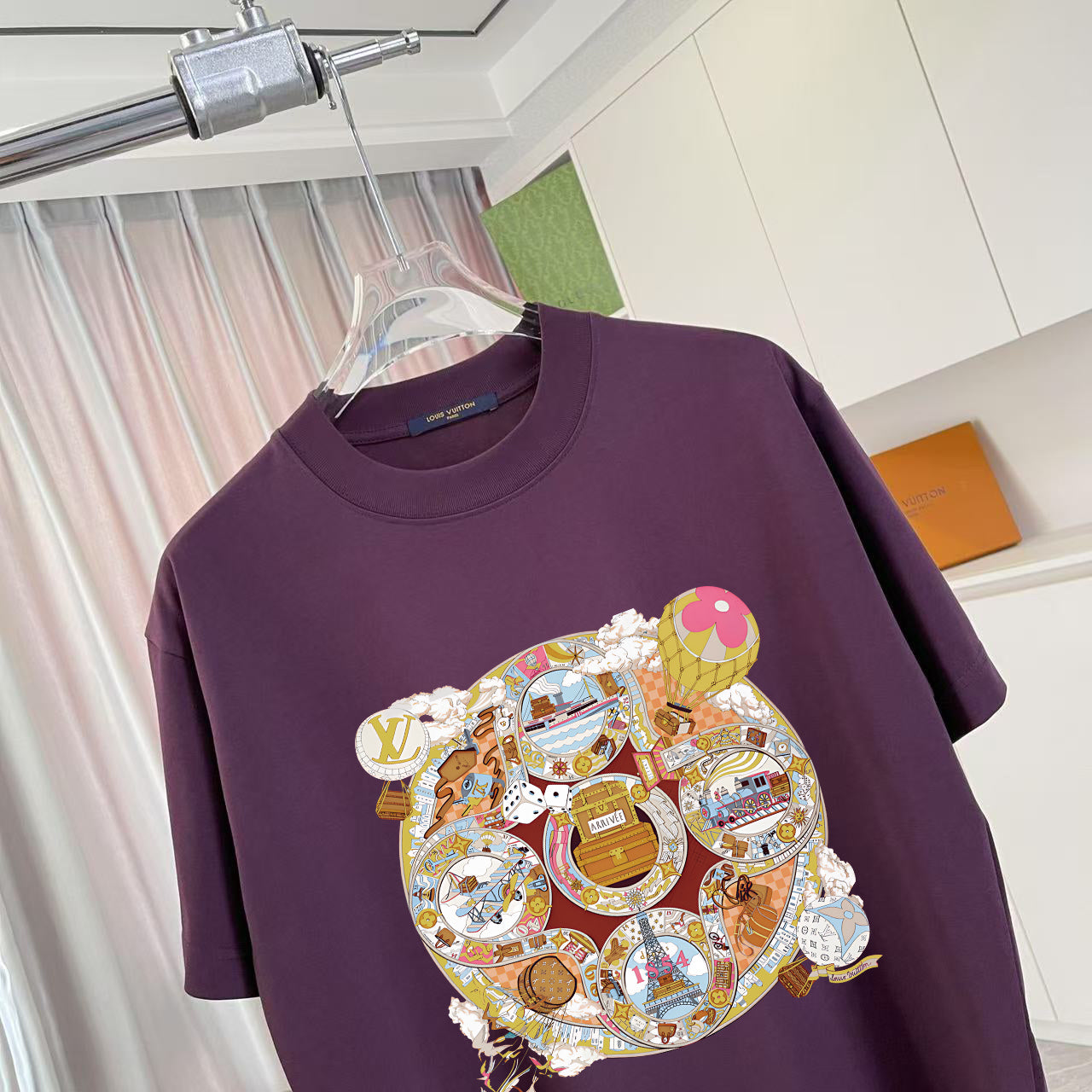 Louis Vuitton dark purple T-shirt with large multicolor bear patch graphic on chest.