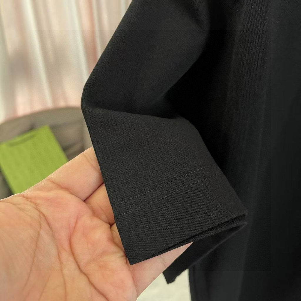 Black T-shirt sleeve cuff with stitched hem