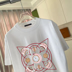 White short-sleeve T-shirt with large red outlined Louis Vuitton-style emblem graphic