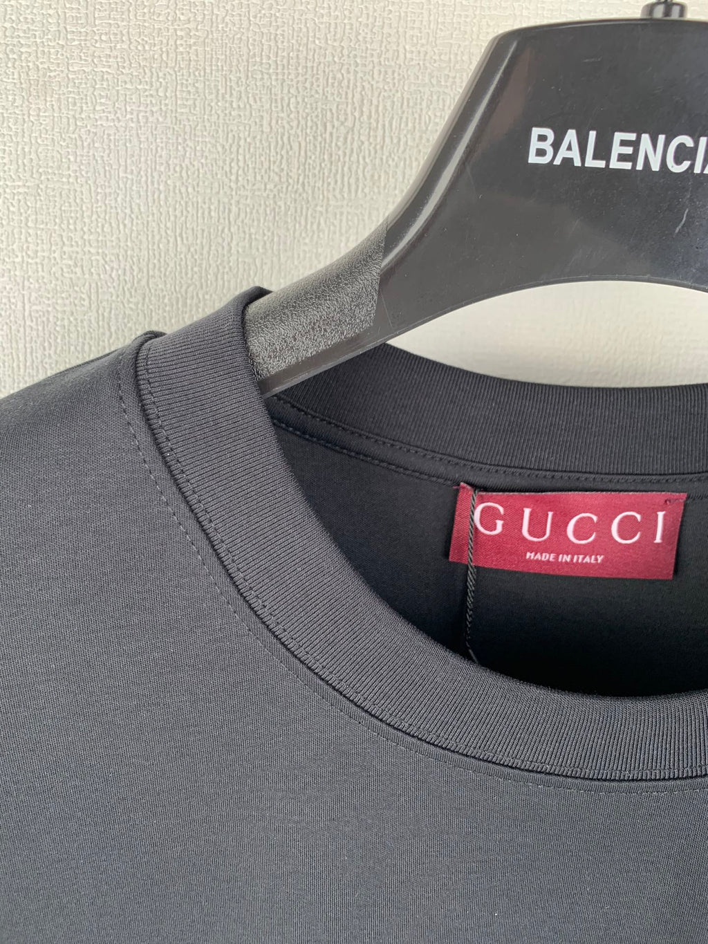 Gucci crewneck T-shirt collar with red Gucci label at neckline, dark blue