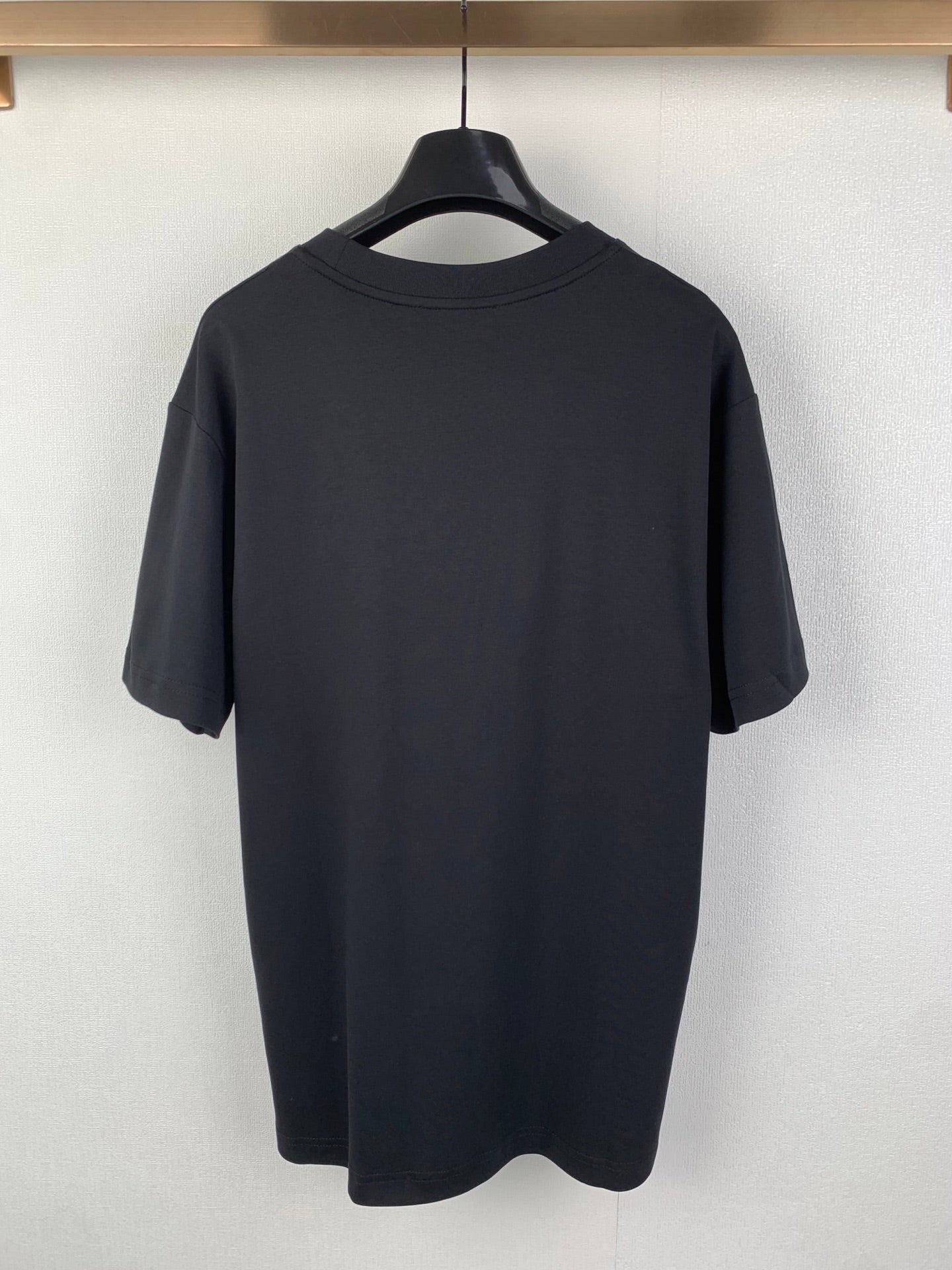 Gucci short-sleeve T-shirt back view on hanger, dark blue