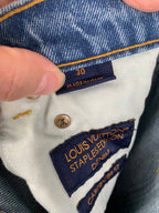 Denim pants with size tag 30 and Louis Vuitton Staples Edition label