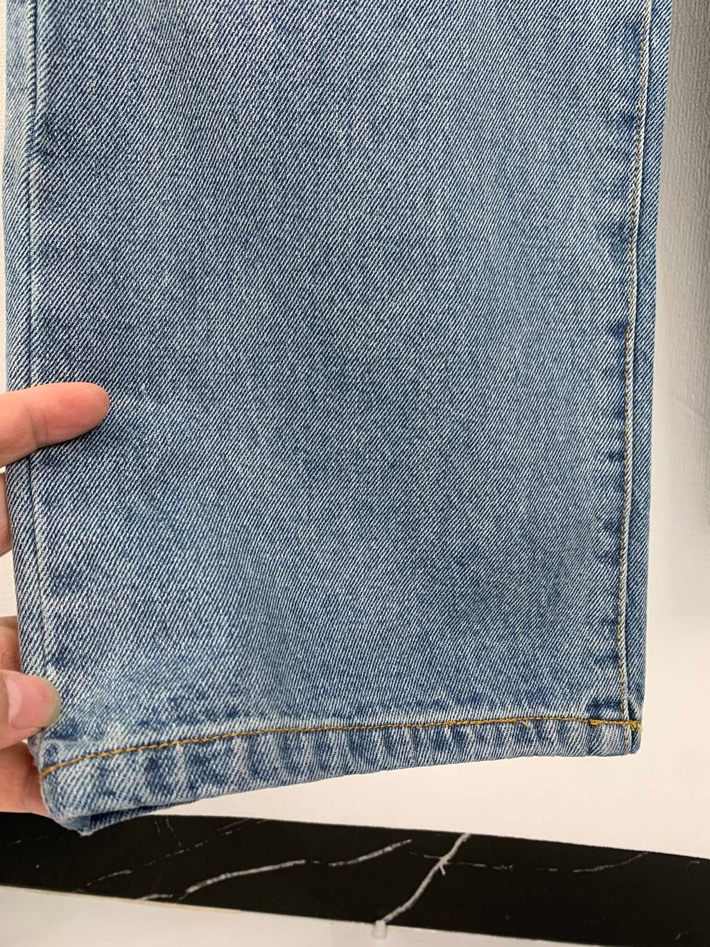 Louis Vuitton light blue denim pants hem with visible cuff stitching detail