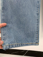 Louis Vuitton light blue denim pants hem with visible cuff stitching detail