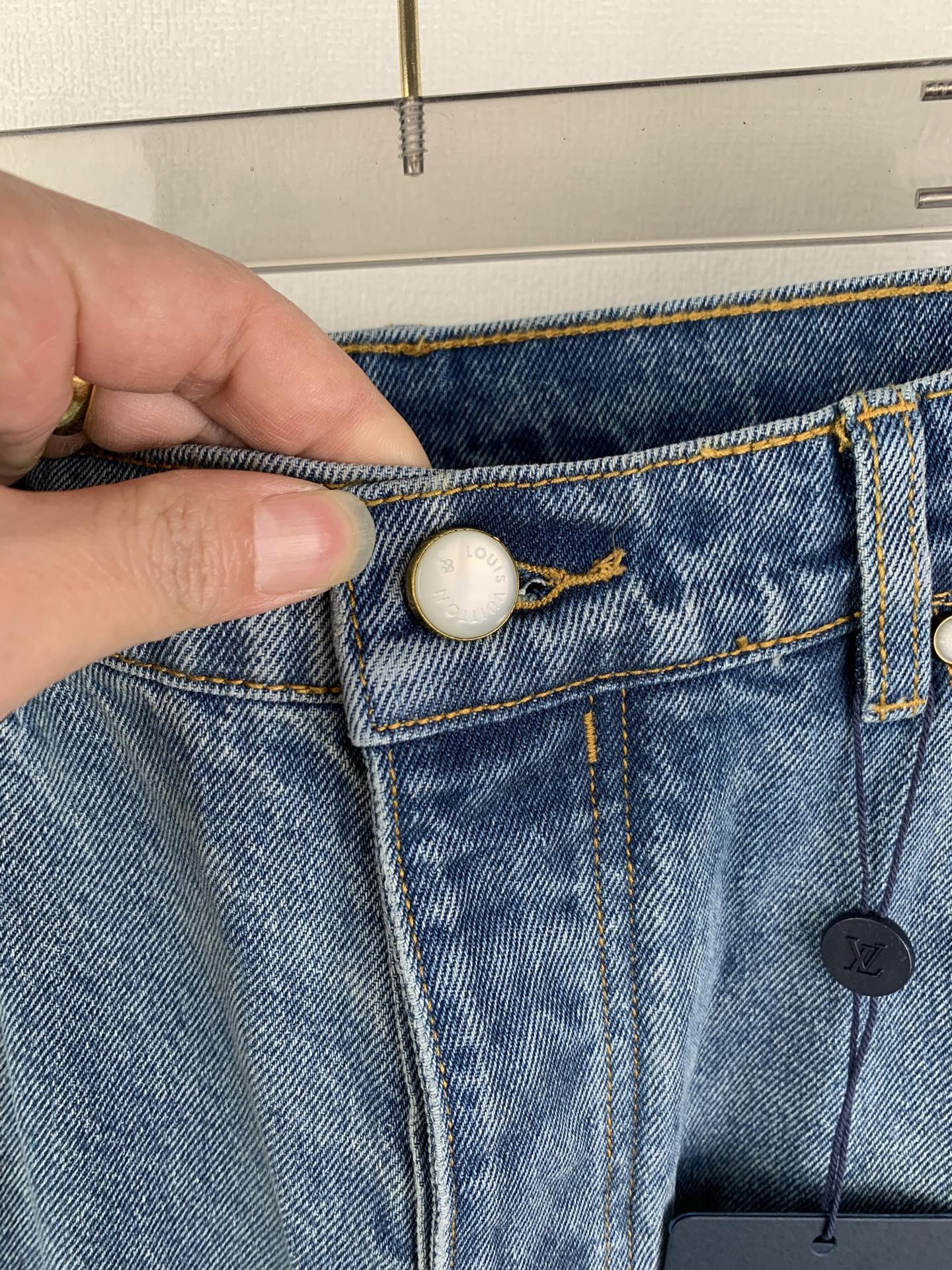 Louis Vuitton light blue denim pants with button closure and embossed coin pocket