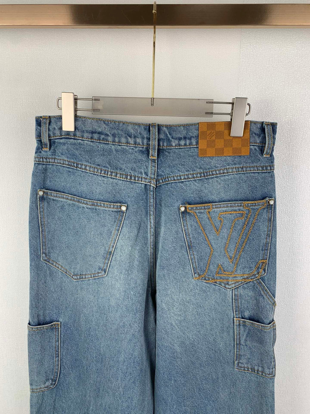 Louis Vuitton light blue denim pants with LV emblem on right thigh pocket