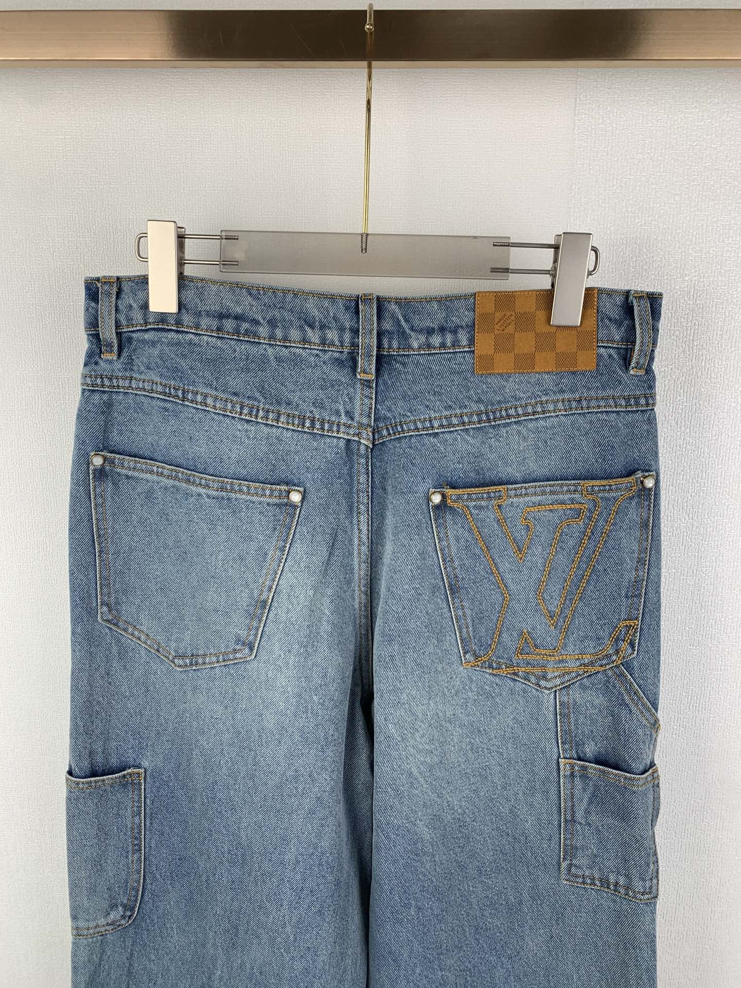 Louis Vuitton light blue denim pants with LV emblem on right thigh pocket