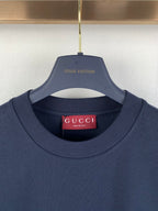 Navy crew-neck T-shirt with Gucci logo label at the collar