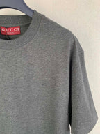 Heather gray Gucci crewneck T-shirt, red GUCCI label at neckline
