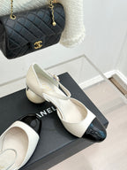 Chanel two-tone slingback pumps, white top with glossy black toe sections