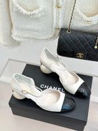 Chanel slingback pumps, white upper with black patent toe and low round heel