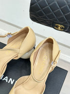 Beige slingback flats with gold-toned strap hardware, CHANEL insole detail