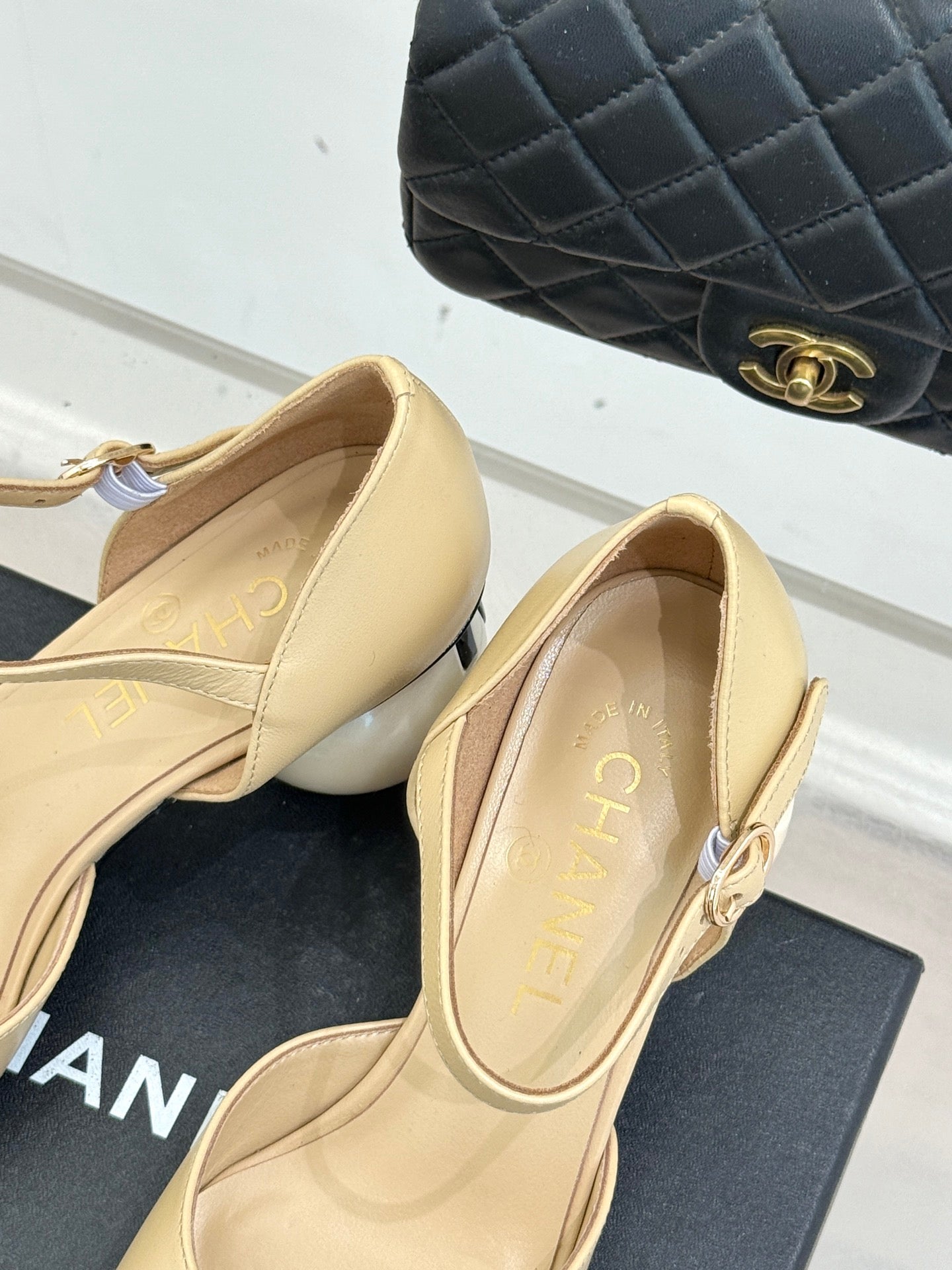 Beige slingback flats with gold-toned strap hardware, CHANEL insole detail