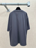 Short-sleeve T-shirt in dark gray, back view on hanger
