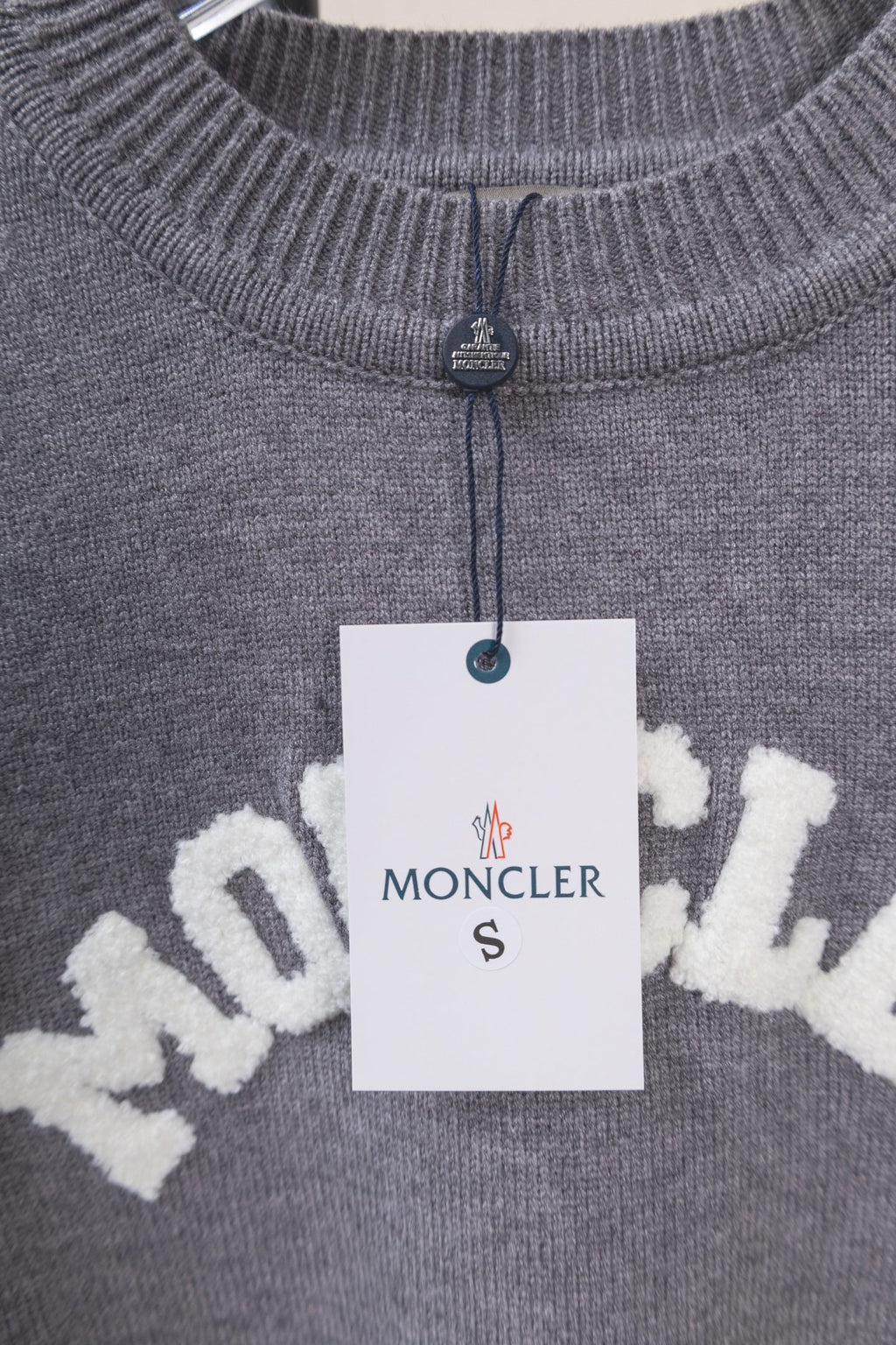 Moncler grey knit sweater with small zip at collar and MONCLER logo tag