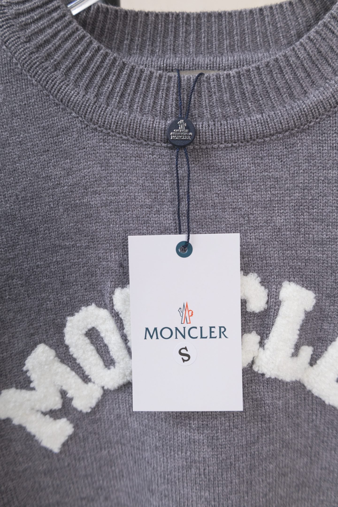 Moncler grey knit sweater with small zip at collar and MONCLER logo tag