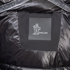 Moncler logo patch on black puffer lining