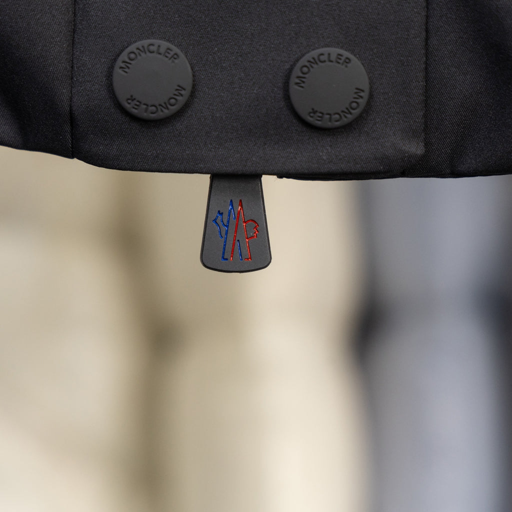 Moncler long puffer jacket snap buttons and logo zipper pull