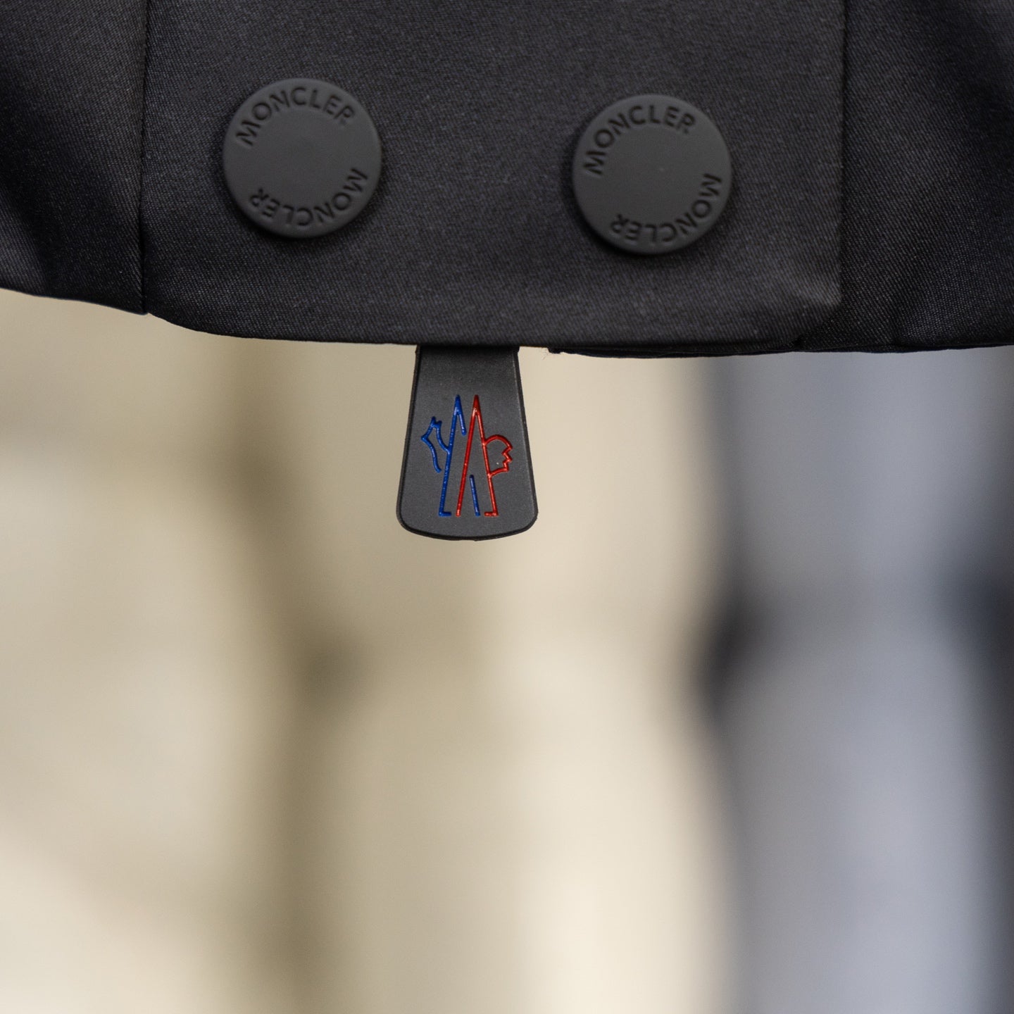 Moncler long puffer jacket snap buttons and logo zipper pull