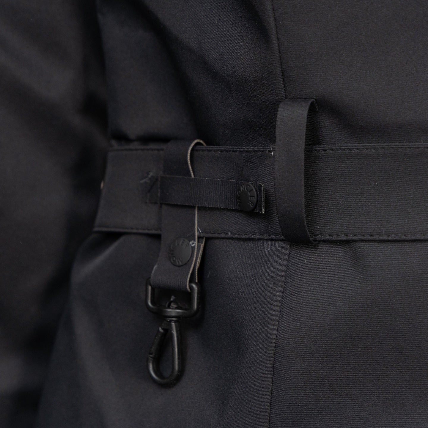 Moncler long parka with adjustable belt strap and hook-and-loop buckle