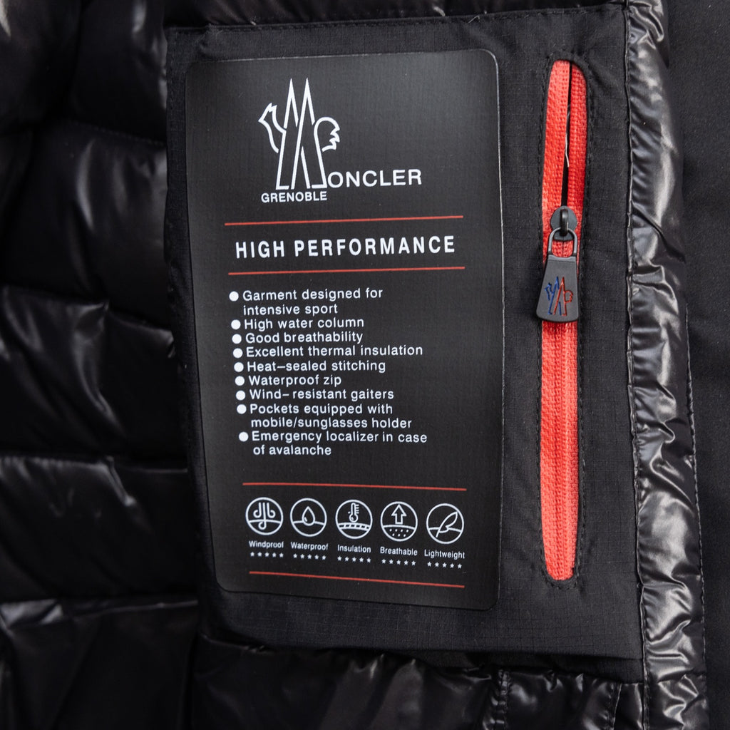 Moncler long puffer jacket interior label and red zipper detail
