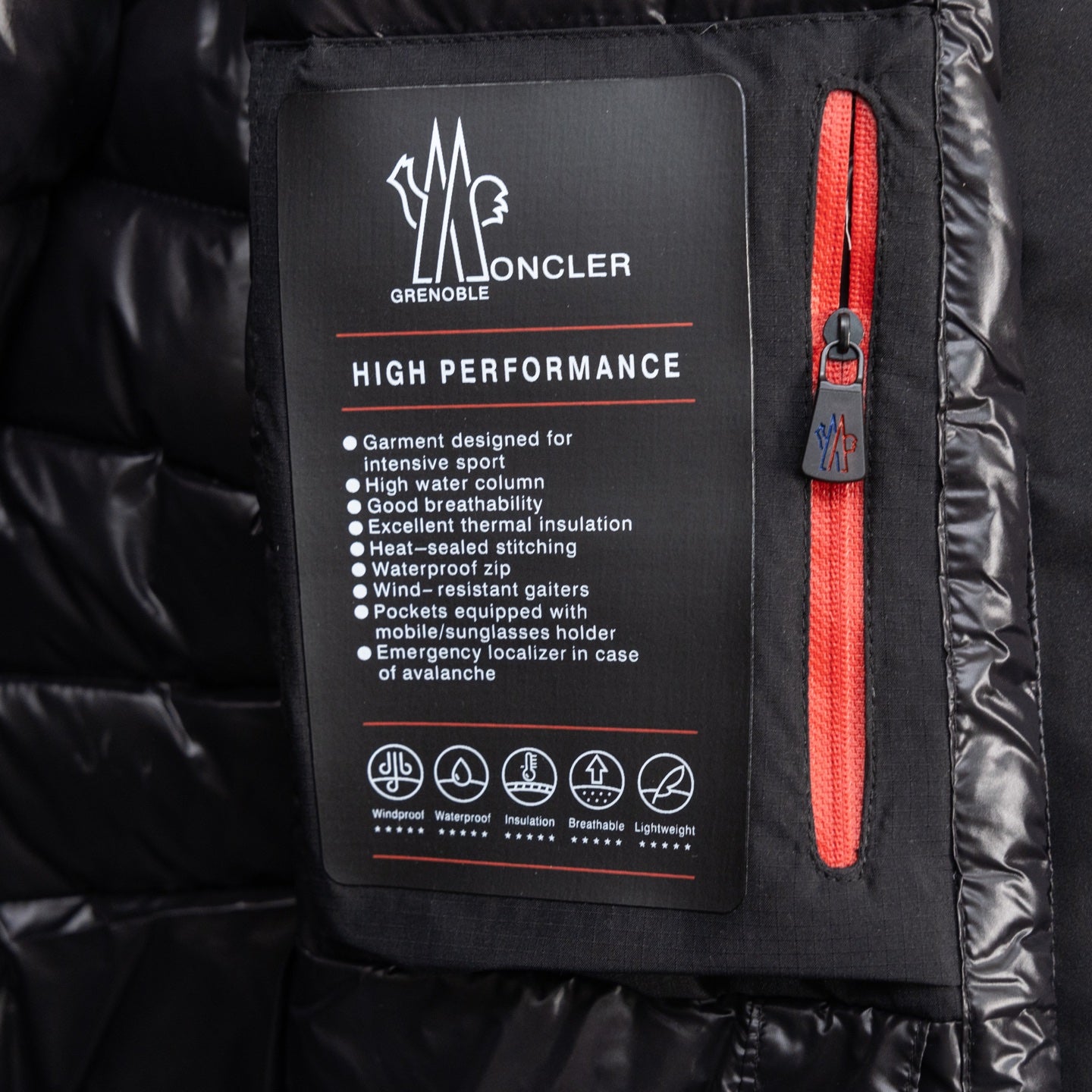 Moncler long puffer jacket interior label and red zipper detail