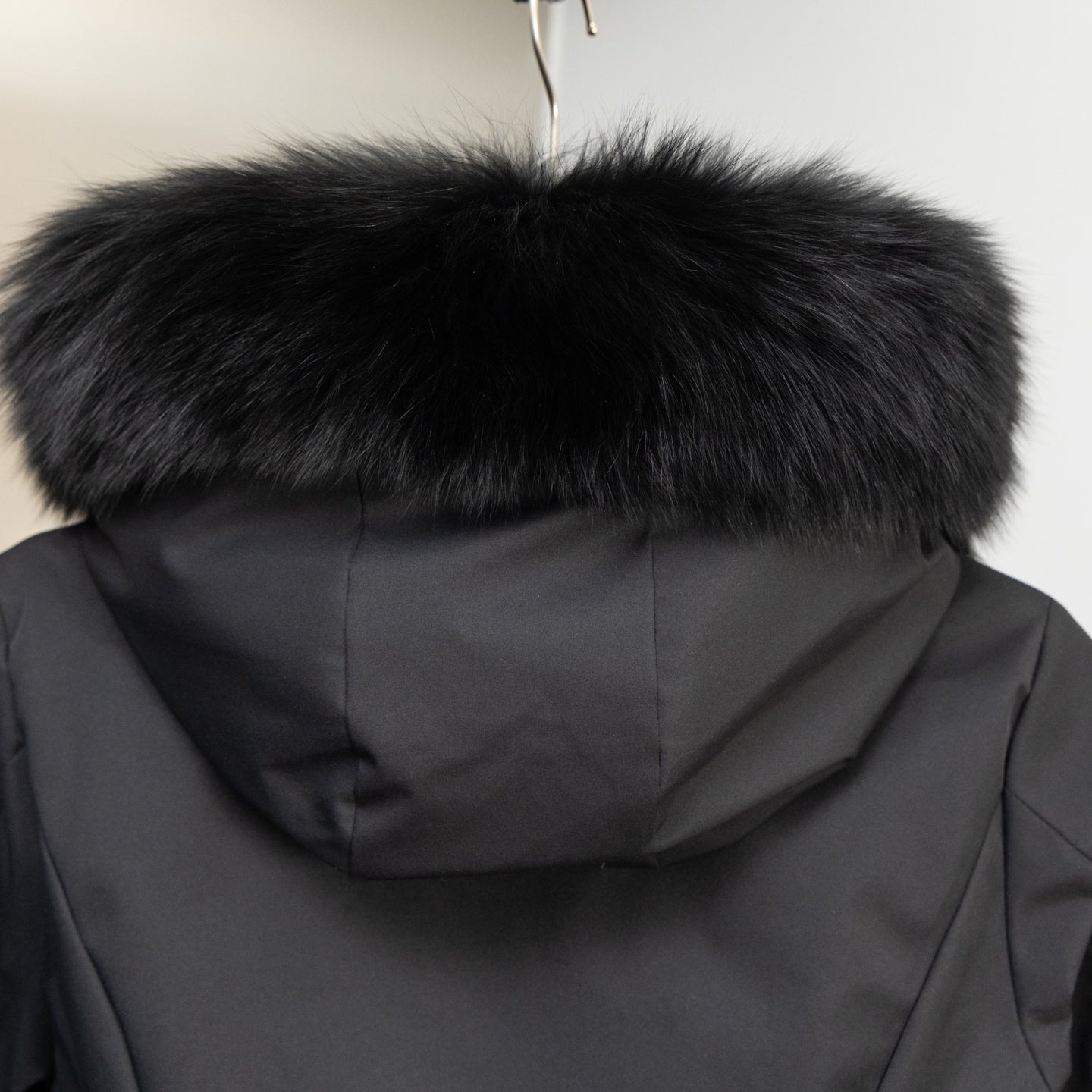 Moncler long puffer jacket hood with black faux fur trim