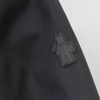 Moncler embroidered logo on dark parka fabric